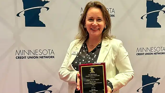 Christine Cordell holding the 2025 Desjardins Youth Financial Education award