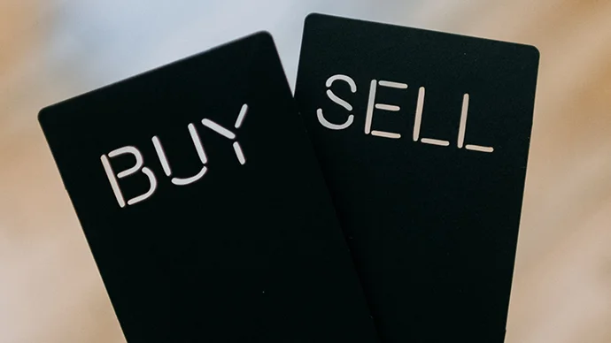 Black cards with options of Buy or Sell